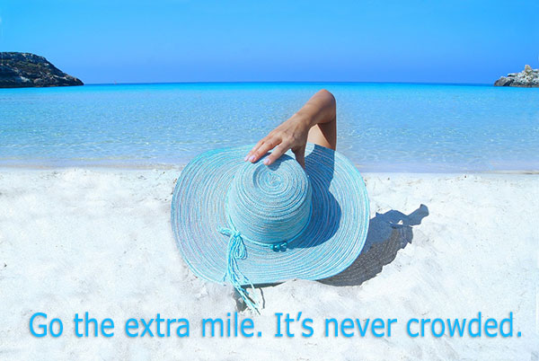 Go the extra mile. It's ever crowded. Girl with blue floppy hat on the beach